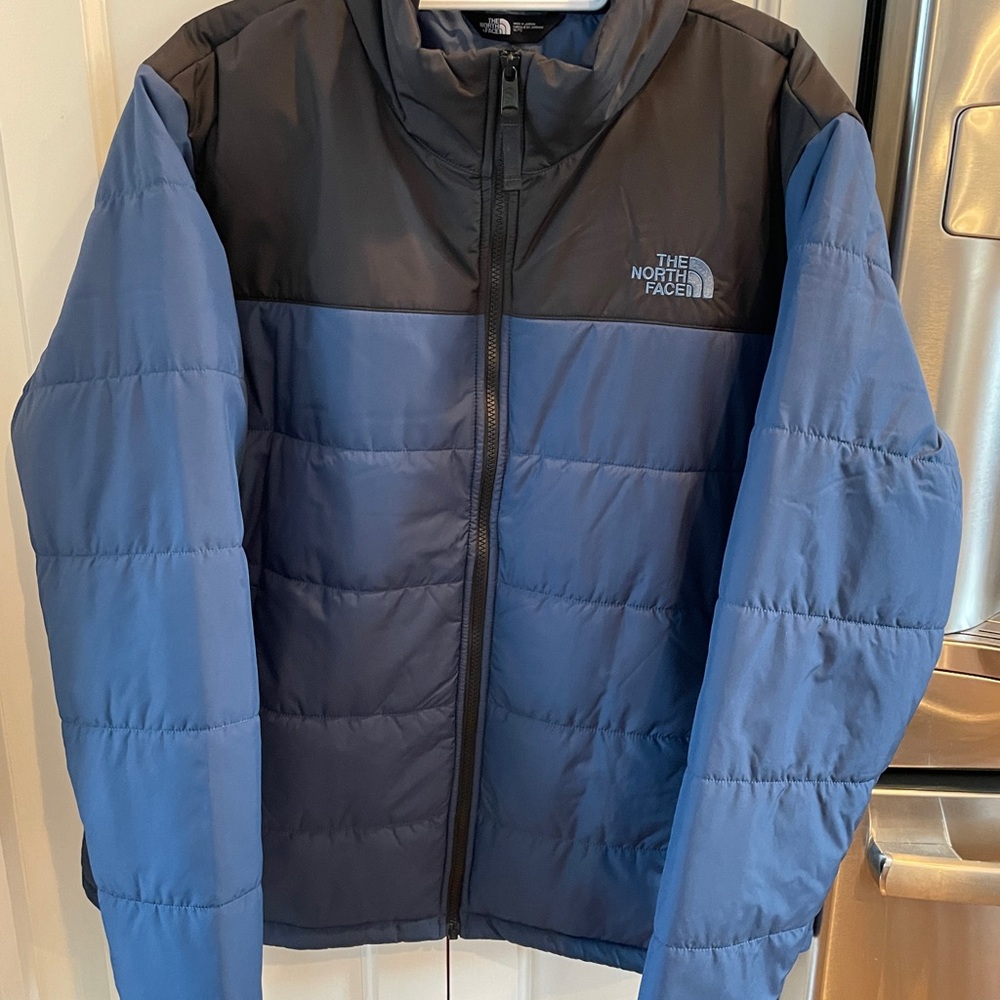 New without tags. Never worn. Warm and stylish North Face Jacket.